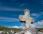 Worn stone cross adorns a grave in Kildavnet-Achill Island-County Mayo-Ireland. Art Print